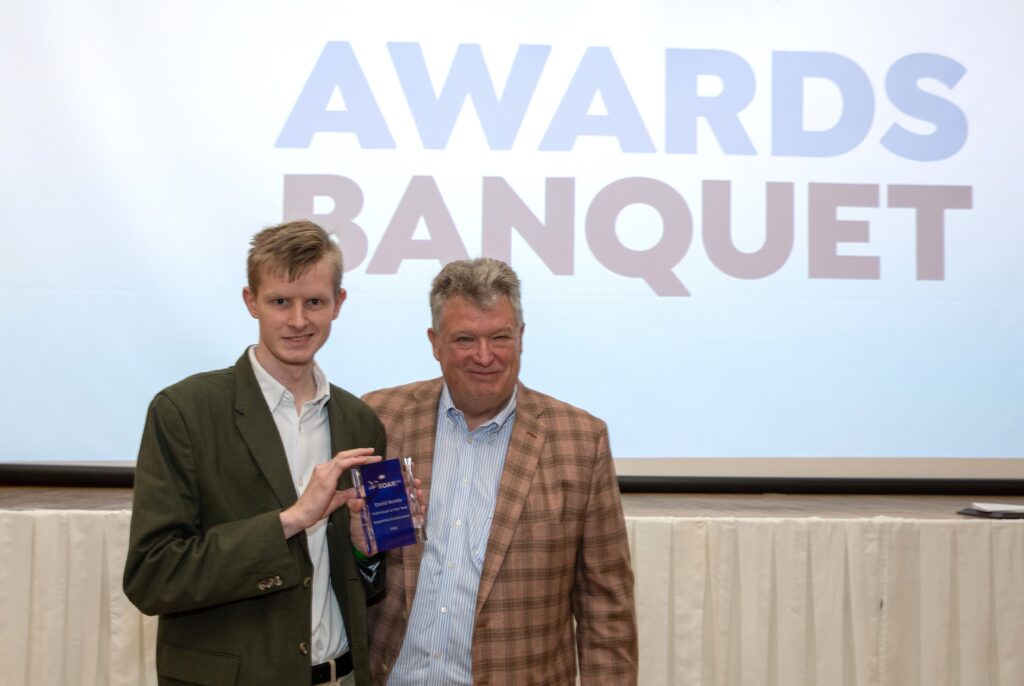 David poses with his award and John Walker, President & CEO of SOAR365.
